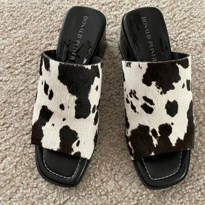 Black and white hair hide Donald Pliner mules size 7 1/2. Never worn